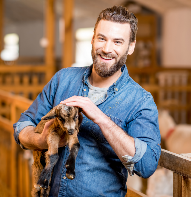 man with goat kid